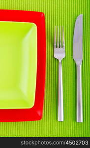 Empty plate with utensils