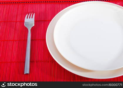 Empty plate with utensils