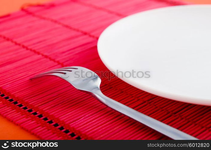 Empty plate with utensils