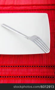 Empty plate with utensils