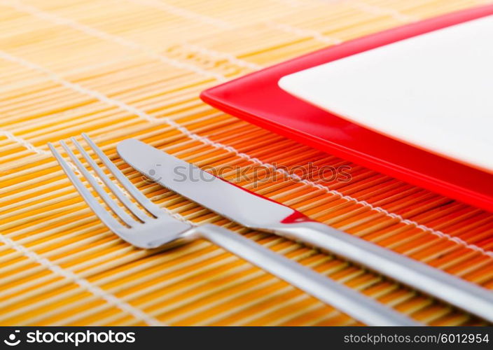 Empty plate with utensils