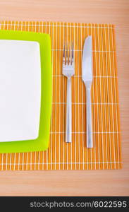 Empty plate with utensils