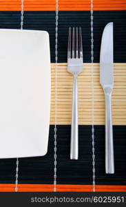 Empty plate with utensils