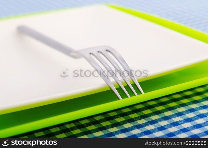 Empty plate with utensils