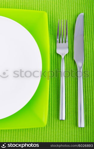 Empty plate with utensils