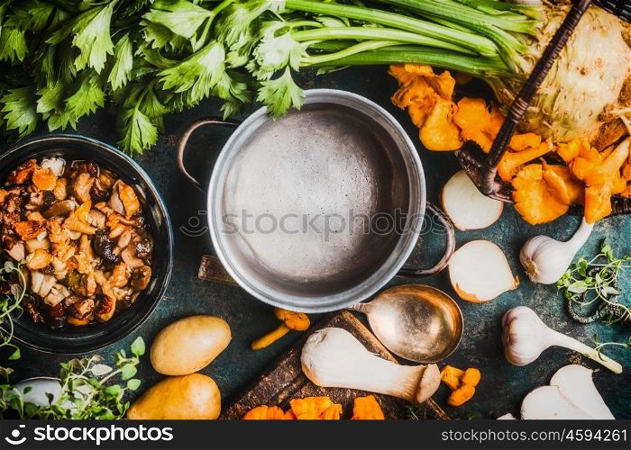 Empty pot and mushrooms cooking ingredients with chanterelles, top view