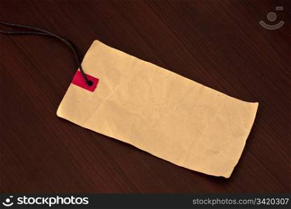 Empty price tag on wooden background
