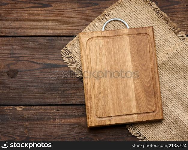 empty rectangular wooden cutting kitchen board on table, top view