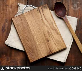 empty rectangular wooden cutting kitchen board on table, top view, copy space