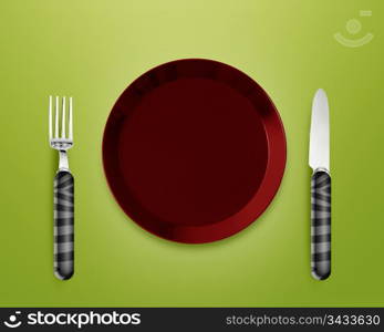 Empty red Plate with knife and fork.