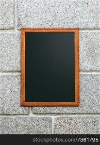 Empty Restaurant Blackboard in a Stone Wall