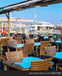 Empty restaurant in Paphos marina at sunset. Cyprus