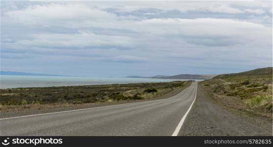Empty road passing through coast, Santa Cruz Province, Patagonia, Argentina