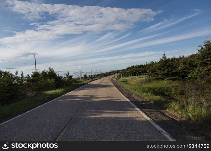 Empty road passing through rural landscape, Margaree Harbour, Cabot Trail, Cape Breton Island, Nova Scotia, Canada