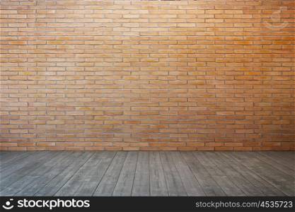 empty room with brick wall and wood floor