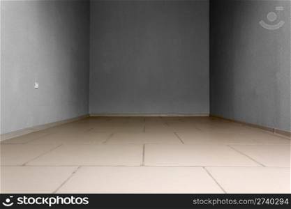 Empty room with electric socket and stone tiles at the floor. Background