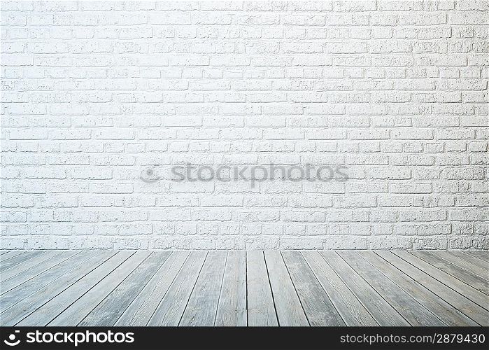 empty room with white brick wall and wooden floor