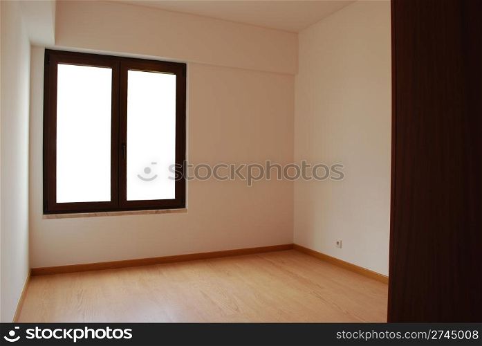 empty room with window and wooden floor