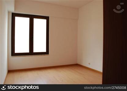 empty room with window and wooden floor