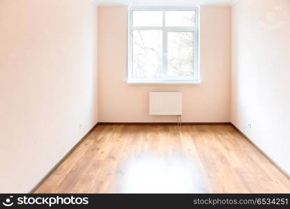 Empty room with window and wooden floor. Light empty room with big white window and wooden floor