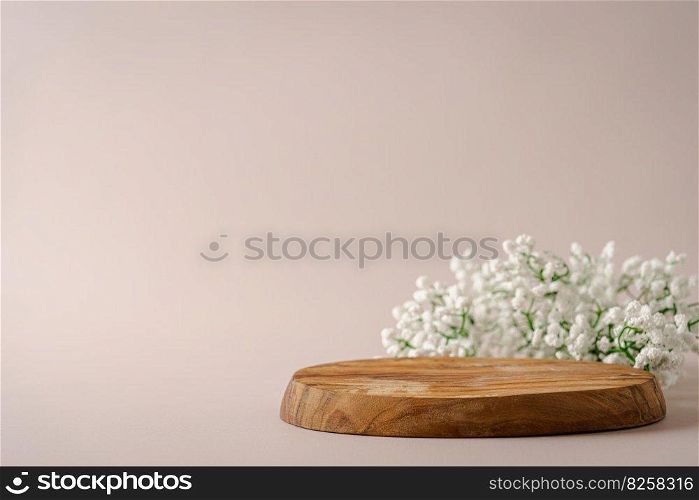 Empty round wooden podium for product presentation on beige background. Scene with geometrical forms. Empty showcase for eco cosmetic product presentation. Background for product presentation.