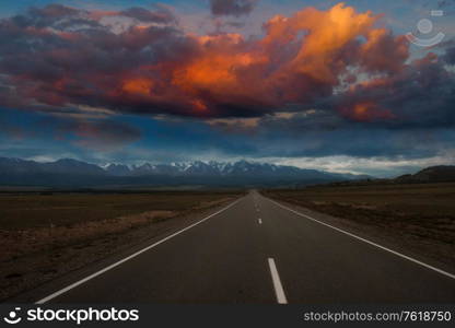 Empty route in Altai mountains with beauty sunset. Altai mountains road