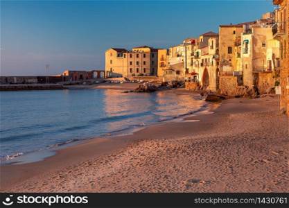 Empty sand beach in old town of coastal city Cefalu at sunset, Sicily, Italy. Cefalu at sunset, Sicily, Italy