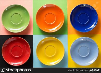 empty saucer at abstract colorful background