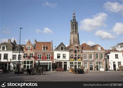 empty square on a sunday morning in Amersfoort with houses and old tower