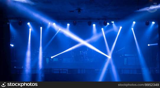 Empty stage concert with colorful lighting laser beam spotlight show in disco pub club bar background for party music dancing festival performance. Entertainment nightlife. Celebration event.