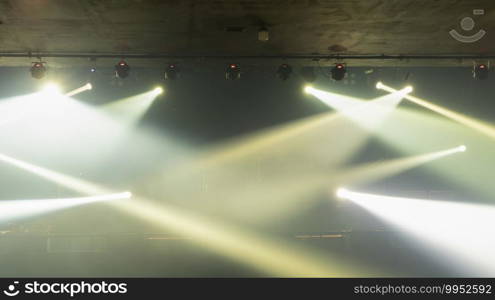 Empty stage concert with colorful lighting laser beam spotlight show in disco pub club bar background for party music dancing festival performance. Entertainment nightlife. Celebration event.