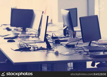 empty startup office interior with modern computers and dual screen monitors