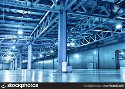 Empty storehouse toned in the blue color
