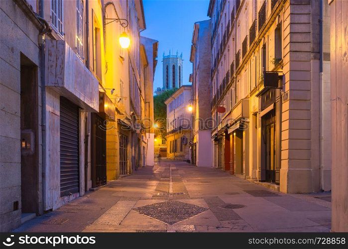 Empty street and Aix Cathedral or Cathedral of the Holy Saviour of Aix-en-Provence at night, Provence, southern France. Aix Cathedral in Aix-en-Provence, France
