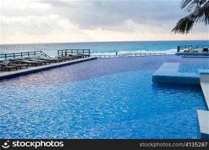 Empty swimming pool and ocean