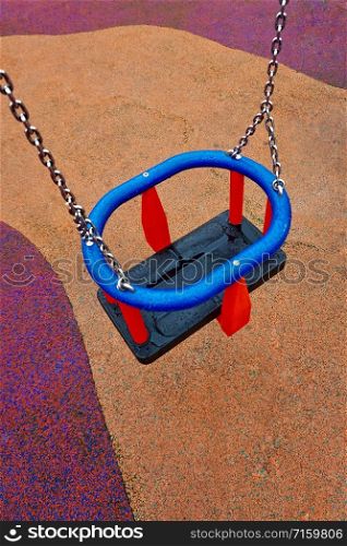 empty swing on the playground on the street