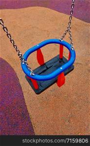 empty swing on the playground on the street