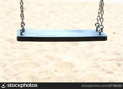 Empty swing set seesaw on playground