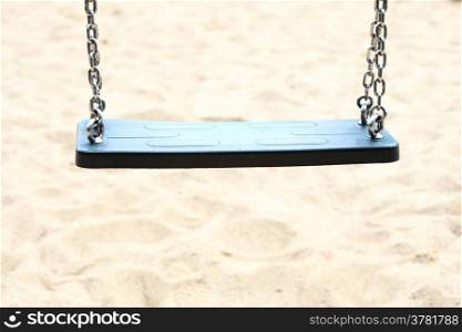 Empty swing set seesaw on playground
