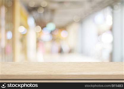 Empty table and blurred store with bokeh background, product display template