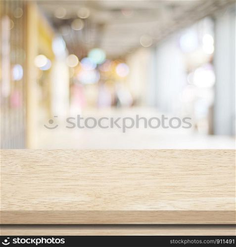 Empty table and blurred store with bokeh background, product display template