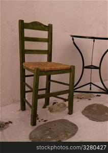 Empty table and chairs in Mykonos Greece