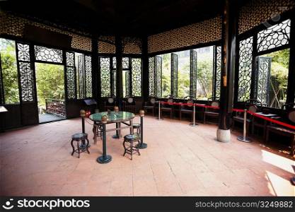 Empty table and stools in a gazebo, Yu Yin Shan Fang, Panyu, Guangzhou, Guangdong Province, China