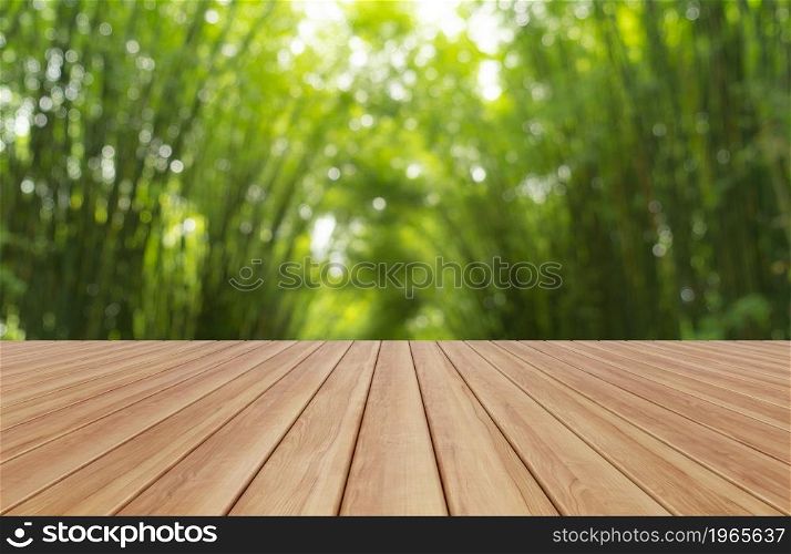 Empty table board with bokeh blurry background of Japanese Bamboo Forest. Tall trees at Arashiyama in travel holidays vacation trip outdoors in Kyoto, Japan. Tall trees in natural park. Nature landsca