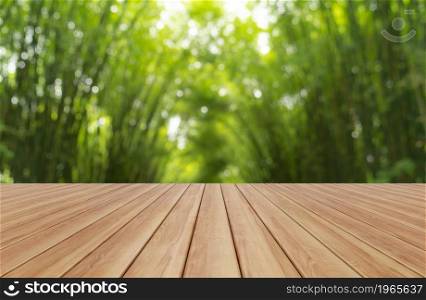 Empty table board with bokeh blurry background of Japanese Bamboo Forest. Tall trees at Arashiyama in travel holidays vacation trip outdoors in Kyoto, Japan. Tall trees in natural park. Nature landsca