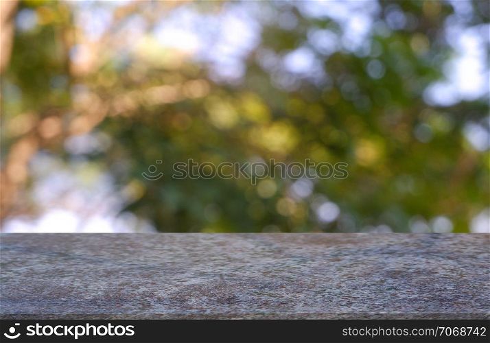 Empty table in front of abstract blurred green of garden and nature light background. For montage product display or design key visual layout - Image
