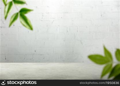 Empty table top, green leaves and white brick wal, Suitable for Product Presentation Backdrop, Display, and Mock up.
