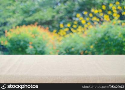 Empty table with linen tablecloth over blur park with bokeh background, food and product display montage