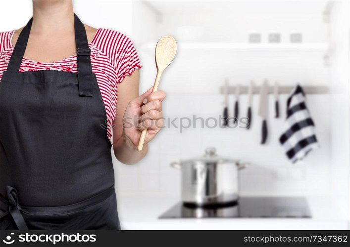 empty template cook holding wooden spoon background concept.. empty template cook holding wooden spoon background concept