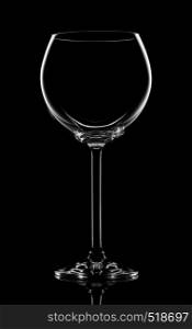 Empty transperent wineglass on a black background